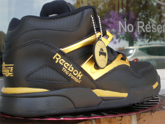 black and gold reebok high tops