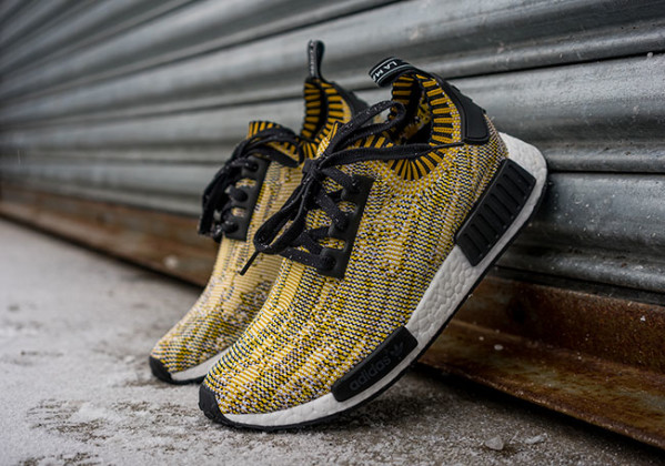 black and yellow nmd