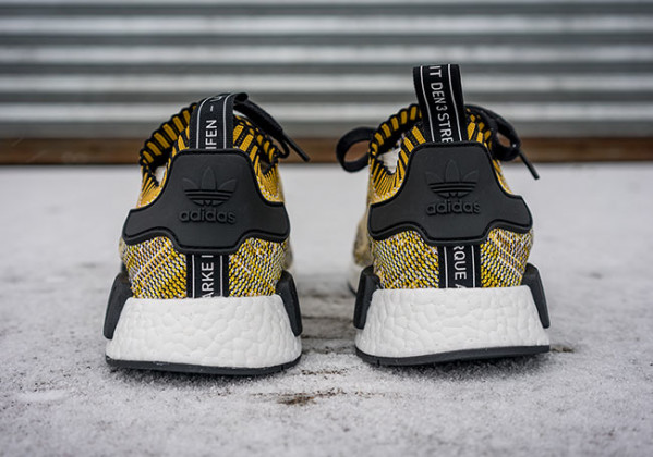 yellow and black nmds