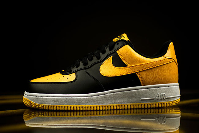 black air force with yellow swoosh