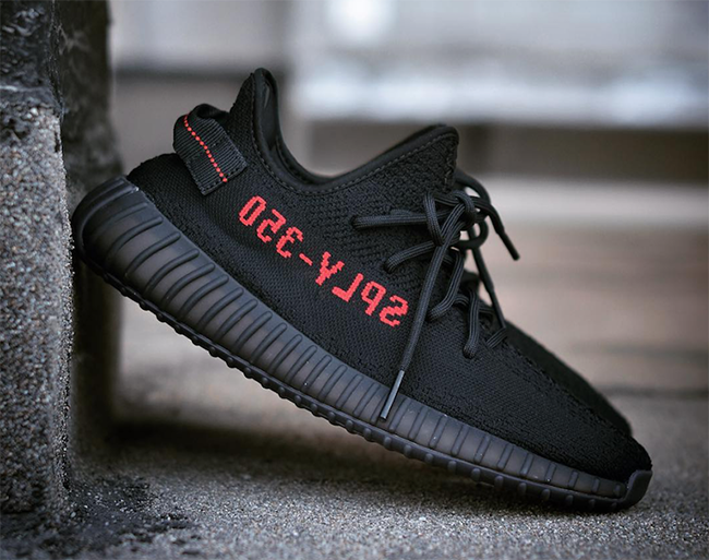 black yeezys with red
