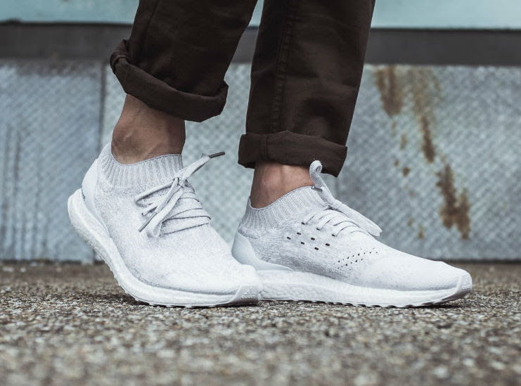 white ultra boost uncaged on foot