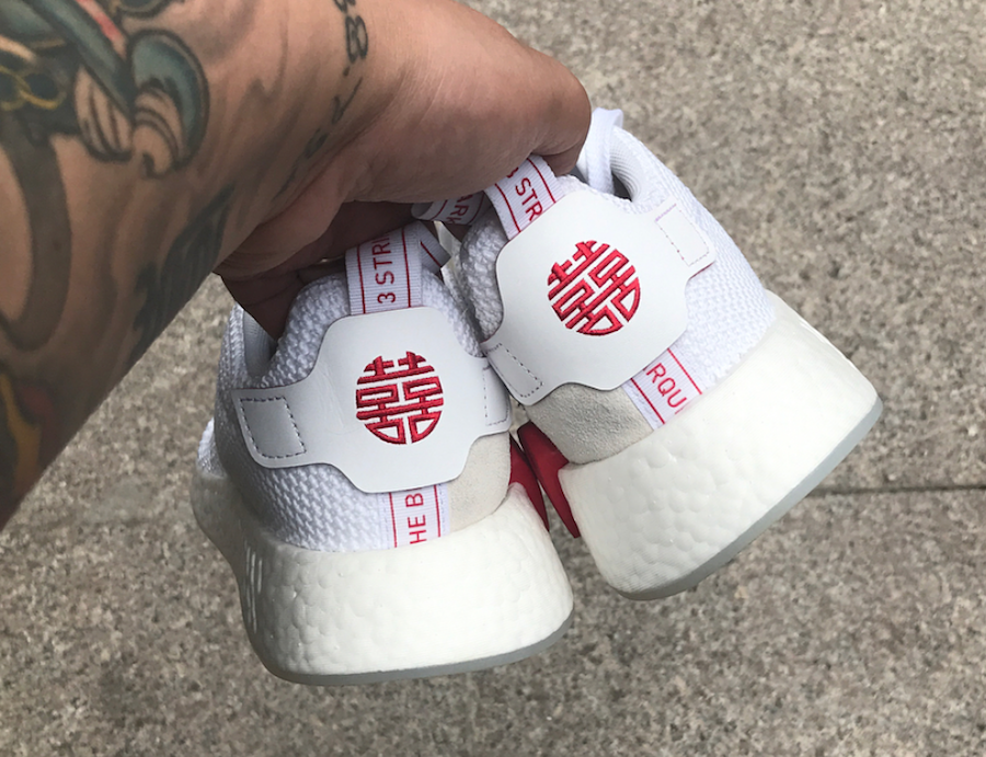 white nmds with chinese writing