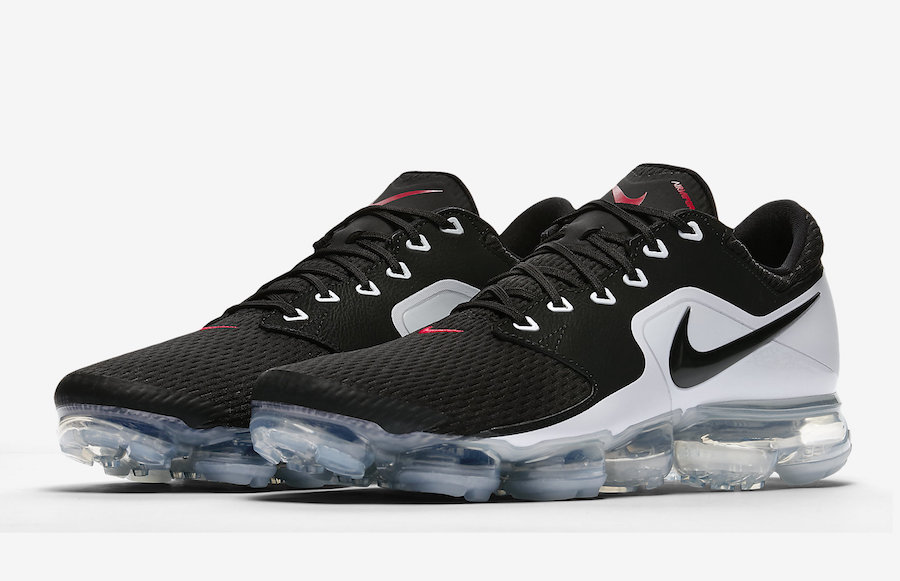 all black vapormax with red check