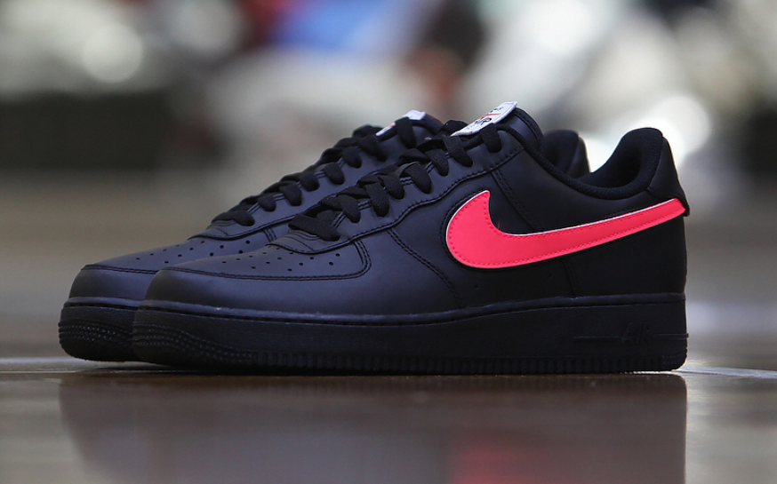 black air forces with red tick