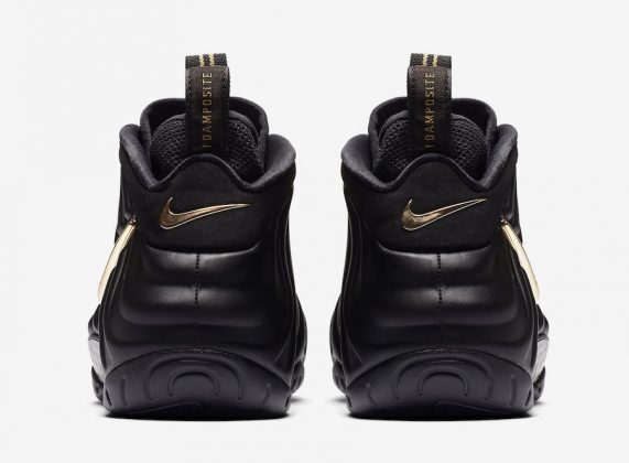 all black foams with gold nike sign