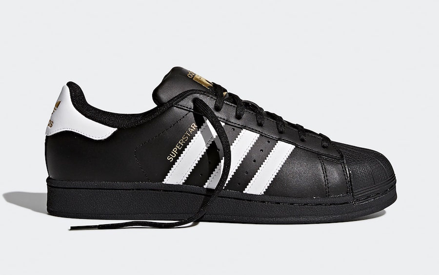 black and gold adidas superstar