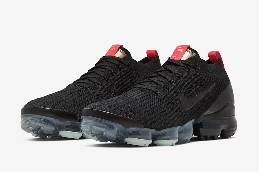 all black vapormax with red check