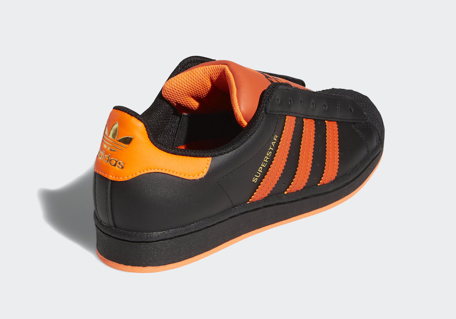 black and orange adidas superstars