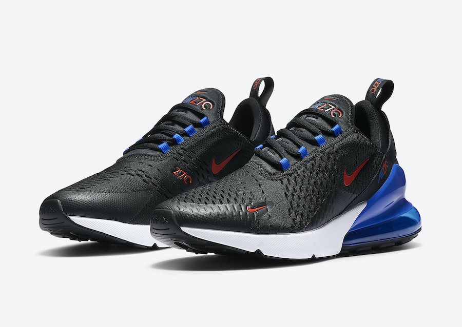 black nike shoes with blue swoosh
